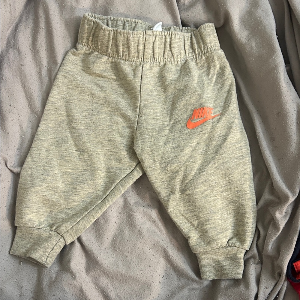 Nike Kids Light Gray Joggers with Orange Logo